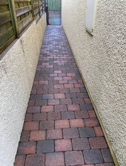 Power washing on block paving path