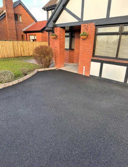 Newly cleaned tarmac driveway and entrance